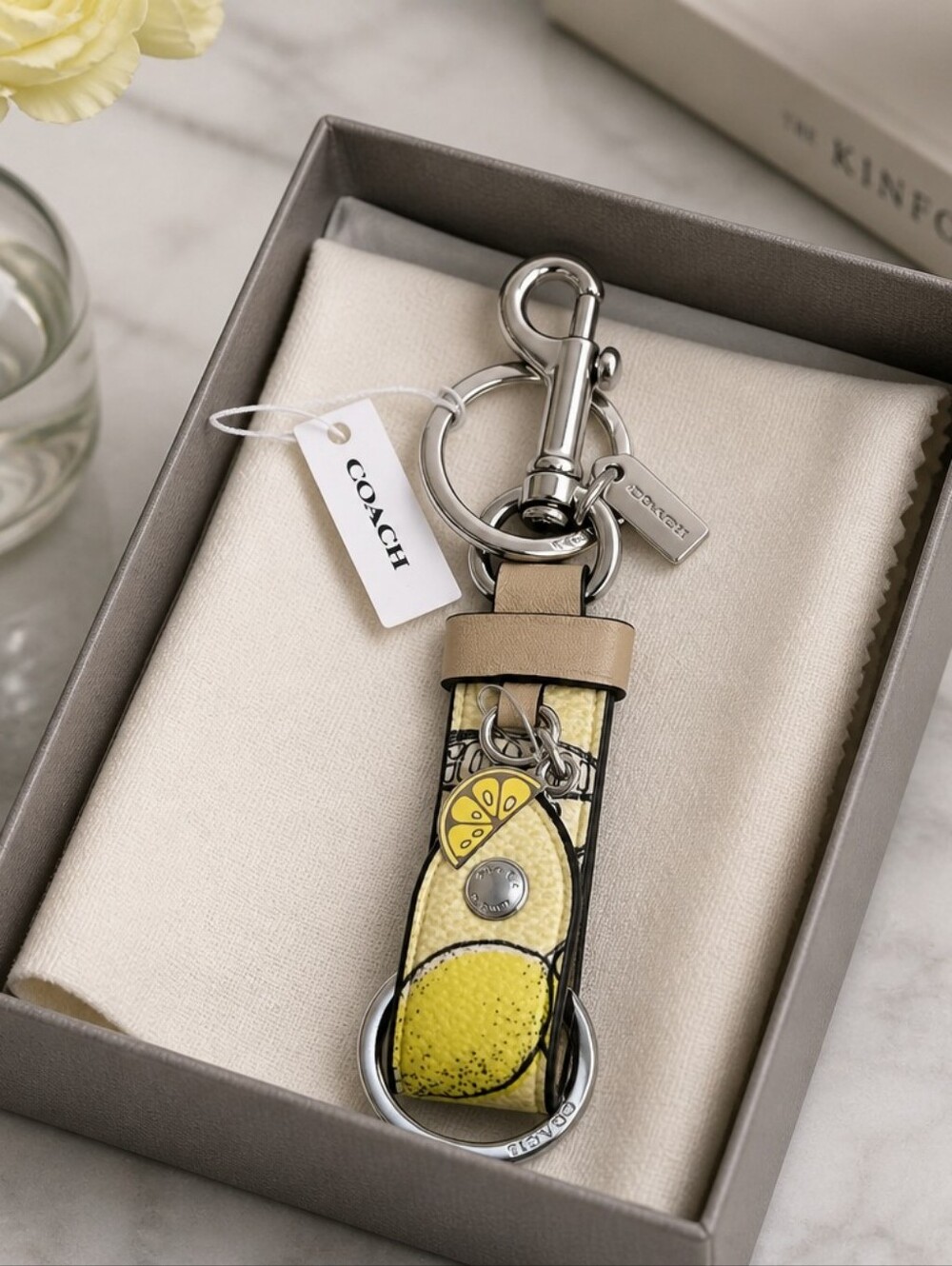 COACH Lemon Print Leather Key Fob in Yellow and Tan